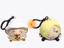 a couple of stuffed animals are fighting each other with a glowing light behind them