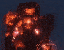 a robot that is on fire with a glowing light in the middle of it