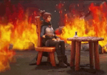 a woman is sitting in a chair in front of a table with fire in the background .