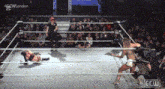 a woman is wrestling another woman in a ring .