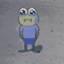 a frog wearing a blue shirt and shorts is standing on a gray surface .