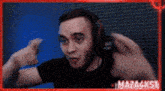 a man wearing headphones is making a funny face