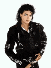 a man wearing a black jacket with the letter a on the sleeves
