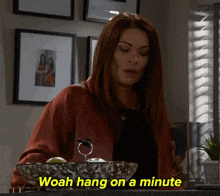 a woman says woah hang on a minute while looking at a bowl