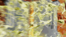 a blurred image of a sword being thrown