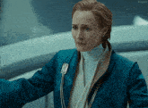 a woman in a blue jacket with the word kepler on the bottom left