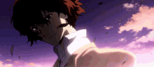 a man with red hair and a mustache is standing in front of a purple sky .