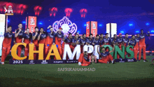 a group of players are posing in front of a large sign that says champions