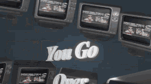 a sign that says " you go " on it in white letters