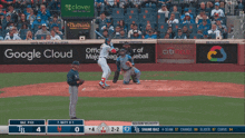 a baseball game is being played with a google cloud ad in the outfield
