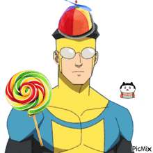 a man in a superhero costume is holding a lollipop and wearing a hat with a propeller on top