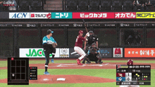 a baseball game is being played in a foreign language with ads for acn and jac