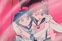 a couple of anime girls hugging each other with the words " axo and este " written on the bottom