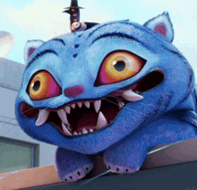 a blue cat with a witch hat on top of it 's head