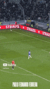 a soccer game is being played on a field with a youtube logo in the corner