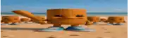 a group of wooden toys are standing on the beach