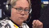 a person wearing headphones and a microphone with technical pause written on the bottom right