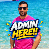 a man in a pink shirt stands in front of a banner that says admin here