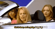 three women are sitting in a car with the words `` get in loser , we 're going golfing '' on the side .