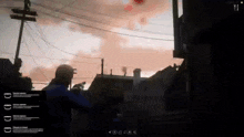 a man in a blue jacket is standing in front of a building holding a gun in a video game .