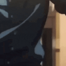 a close up of a person 's back with a shadow of a person on it .