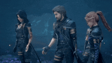 a man and two women are standing next to each other in a video game