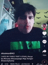 a man with a mustache is wearing a black shirt with xbox on it