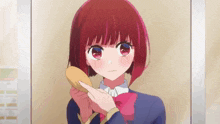 a girl with short red hair is brushing her hair