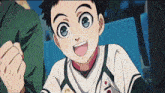 a young boy wearing a white shirt with a red circle on it