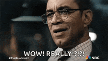 a man with glasses is making a surprised face and saying wow ! really !