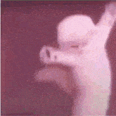 a blurry picture of a person with their arms up