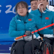 Giggle Wheelchair Curling GIF - Giggle Wheelchair Curling Yan Zhuo GIFs