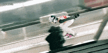 a blurred image of a person skiing with lewanaria written in the upper right corner