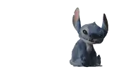 a blue stuffed animal is laying on its back