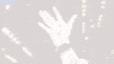 a person 's hand is reaching out towards the sky
