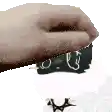 a close up of a person 's hand holding a piece of paper with the time written on it .