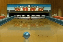 a bowling alley in a video game with a bowling ball in the middle