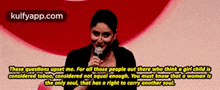 a woman speaking into a microphone with a quote from kulfyapp.com above her