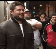 a man wearing a jacket that says ' smiths ' on it