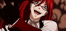 a man with red hair and glasses is smiling