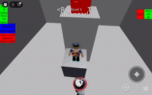 a screenshot of a game called alcanzarlo shows a person sitting on a red cube