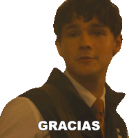 a man in a suit and tie says gracias in spanish