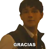 a man in a suit and tie says gracias in spanish