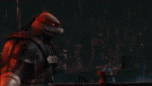 a teenage mutant ninja turtle is standing in the rain with a city in the background .