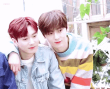 two young men are sitting next to each other with the word cherry on the bottom right corner
