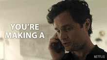 a man talking on a cell phone with the words " you 're making a " on the bottom