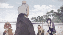 a group of anime characters are standing around a man