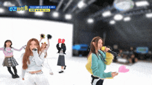 a group of girls are singing in front of a sign that says ' girls ' on it