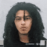 a picture of a man with dreadlocks and piercings on his face is displayed on a website called minimax