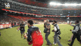 a man holding a trophy in a stadium that says ipl final on it